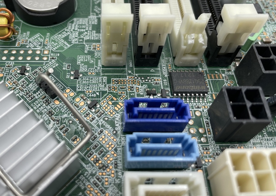 Image of the Winbond 16-Pin BIOS Chip on a HP 8300 Small Form Factor motherboard.